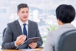 A candidate speaking one to one with a recruiter about a new role.